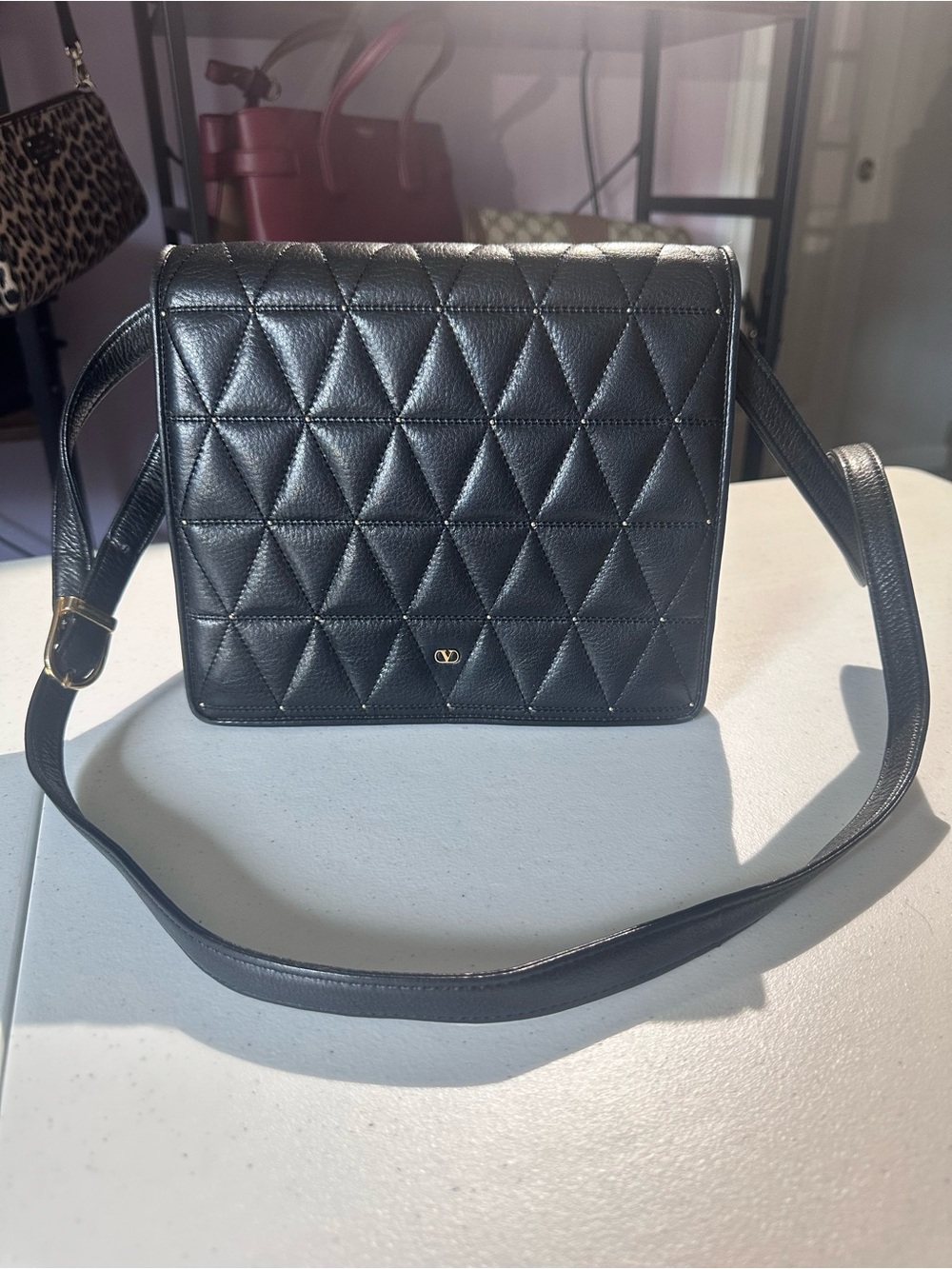 Valentino Garavani Black Quilted Leather Crossbody Bag with Gold Accent
